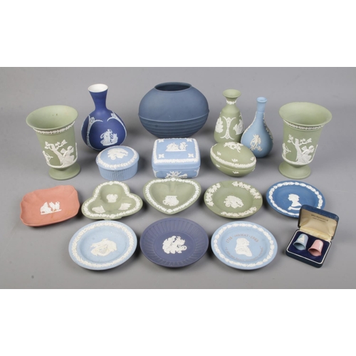 17 - A collection of Wedgwood Jasperware including trinket boxes, dishes, urns and rare dark blue ovoid b... 