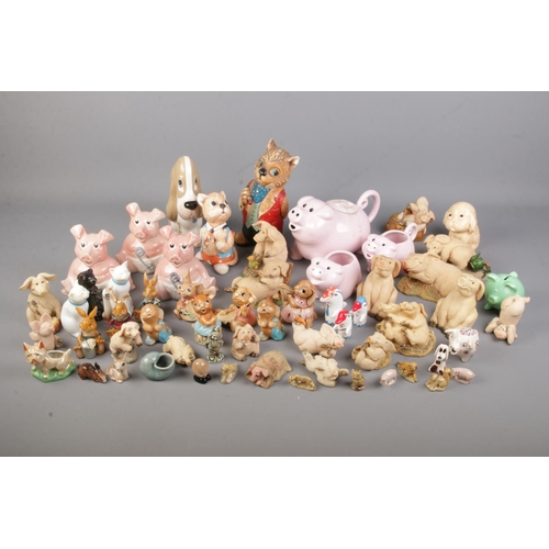 180 - A large collection of piggin's figures with a selection of Pendelfin figures and other collectable a... 