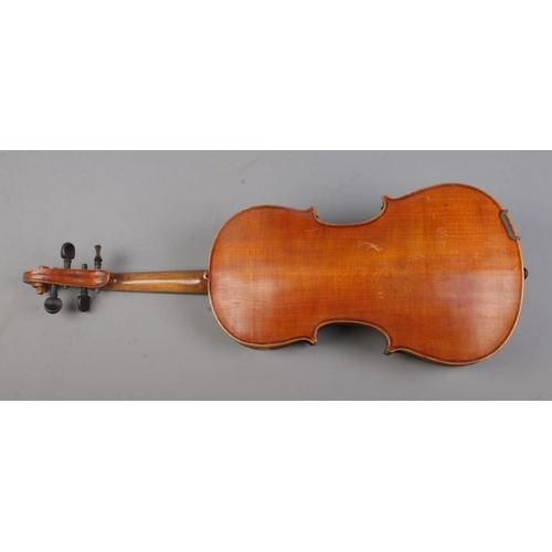 59 - An antique two piece back violin in case.

Body length 36cm