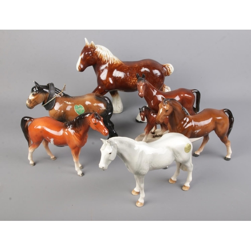 6 - A collection of ceramic horses including Beswick dapple grey example.