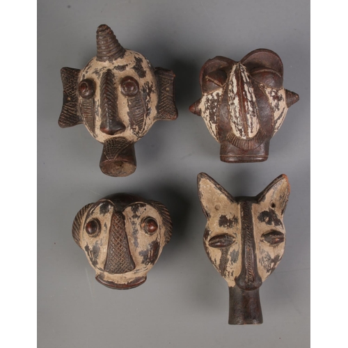 513 - A set of four Conglese Pende style passport masks.