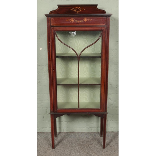 553 - An Edwardian mahogany inlaid cabinet of slender proportion.

Hx148cm
Wx61cm
Dx29cm