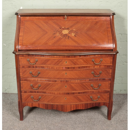 564 - A French style bureau with central marquetry floral design over parquetry body.

Hx103cm
Wx95cm
Dx53