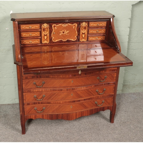 564 - A French style bureau with central marquetry floral design over parquetry body.

Hx103cm
Wx95cm
Dx53