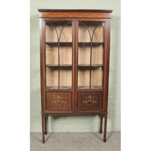 580 - An Edwardian inlaid mahogany display cabinet with hand painted detail to frieze and door panels.

Hx... 