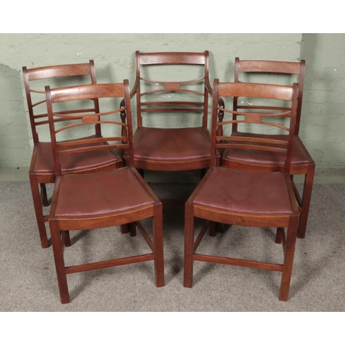 582 - A set of five mahogany dining chairs including one carver