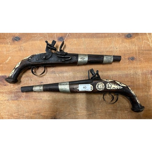40 - A collection of toy and decorative guns including a pair of decorative flint lock pistols CANNOT POS... 