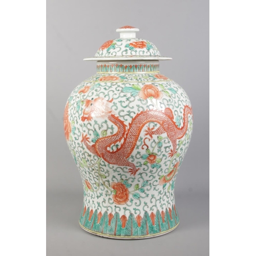 97 - A large Chinese Famille Vert dragon jar with cover, of baluster form. Featuring central dragon in fr... 