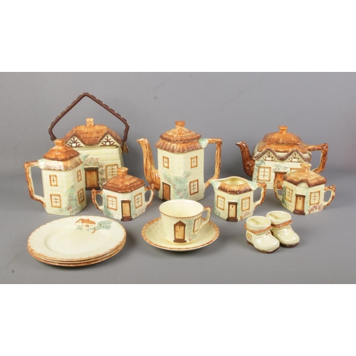 252 - A box of mainly Keele St. Pottery cottageware. Includes biscuit barrel, cup and saucer, plates and p... 