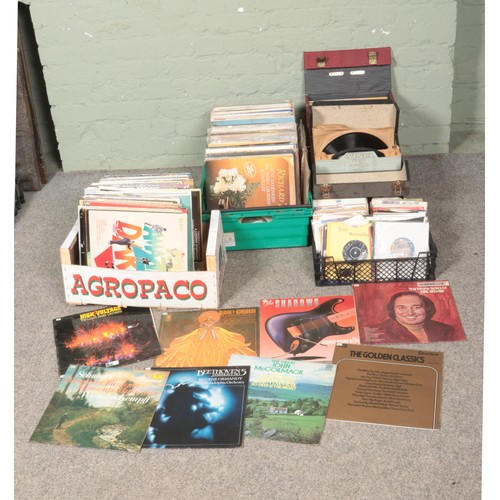 257 - Three boxes and two cases of assorted records. Single records include Queen, The Beatles, UB40, Thin... 