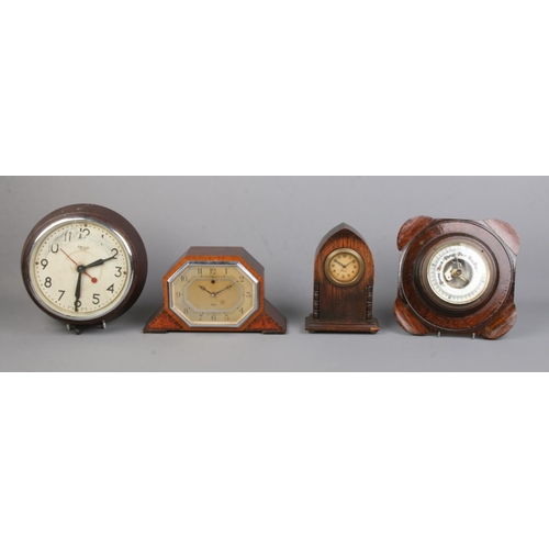 192 - Three clocks together with a small oak wall mounted barometer. To include Smiths Sectric and Precist... 