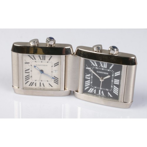 1 - A Cartier Tank Francaise stainless steel dual time folding desk/travel alarm clock. Having white and... 