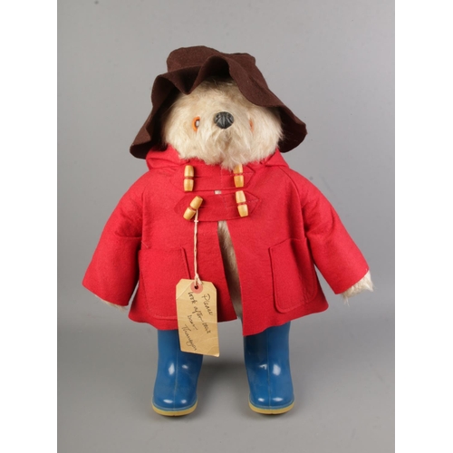 104 - A Gabrielle Design Paddington Bear with blue boots, red jacket and brown hat.