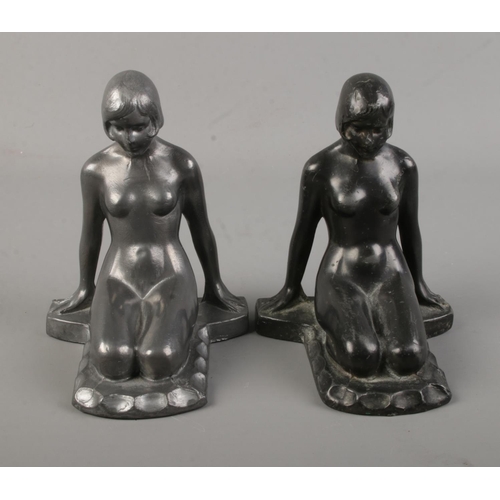 109 - A pair of Art Deco spelter bookends of nude maidens.