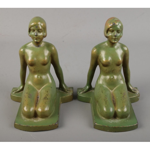 111 - A pair of Art Deco spelter bookends of nude maidens with faux verdigris finish.