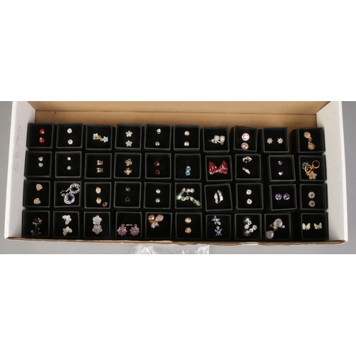 123 - A large quantity of costume jewellery earrings. Includes paste set, enamelled etc.