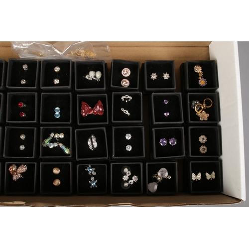 123 - A large quantity of costume jewellery earrings. Includes paste set, enamelled etc.