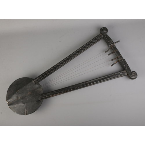 126 - An Ethiopian five string Krar/lyre. 

The Krar, along with Masenqo and the Washint, is one of the mo... 