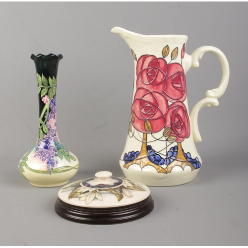 134 - Three pieces of tubelined ceramics, to include Old Tupton Ware jug depicting flowers and berries, bu... 