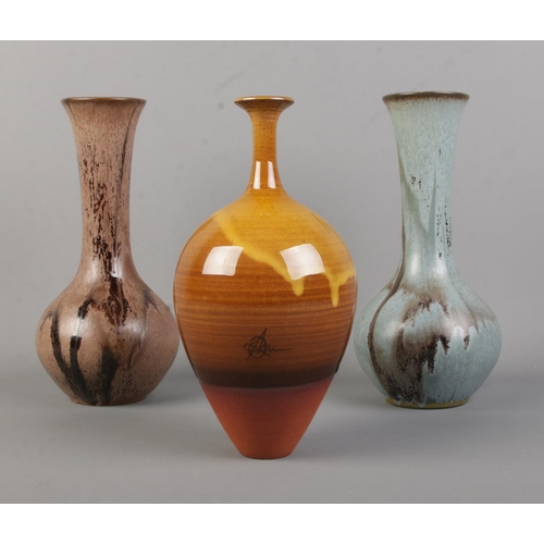 136 - A Russell Akerman 'Amber Sunrise' studio pottery vase, together with two Blue Mountain Pottery of Ca... 