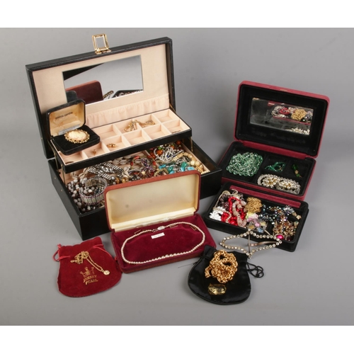 139 - Two jewellery boxes with contents of costume jewellery. Include three chains stamped '9K', rolled go... 