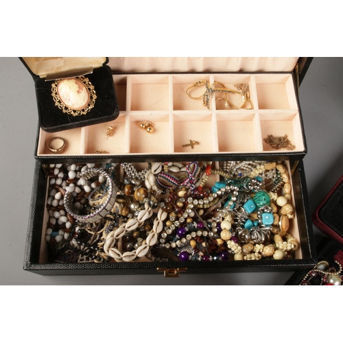 139 - Two jewellery boxes with contents of costume jewellery. Include three chains stamped '9K', rolled go... 