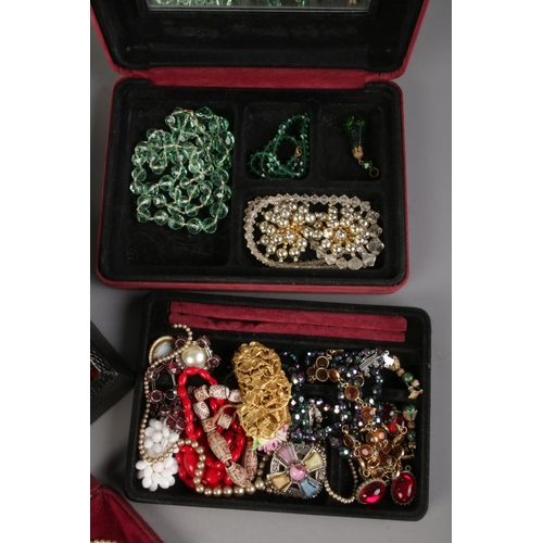 139 - Two jewellery boxes with contents of costume jewellery. Include three chains stamped '9K', rolled go... 