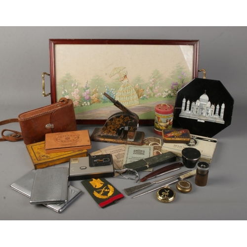 149 - A box of collectables. Includes embroided tray, Kodak autographic brownie No.2, vintage tins, cigare... 