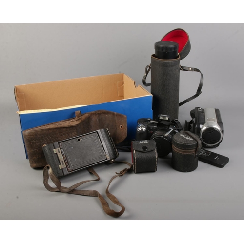 152 - A collection of photographic equipment. Includes Canon S5IS, Prinz Galaxy lenses, Kodak bellows came... 