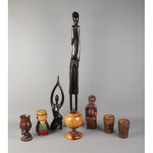 161 - A collection of assorted woodenwares, to include tall carved tribal figure, turned tobacco jar and c... 