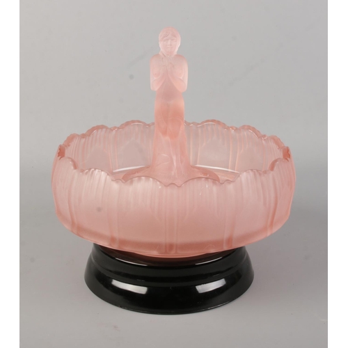 164 - An Art Deco pink glass float bowl on stand with figural centre.