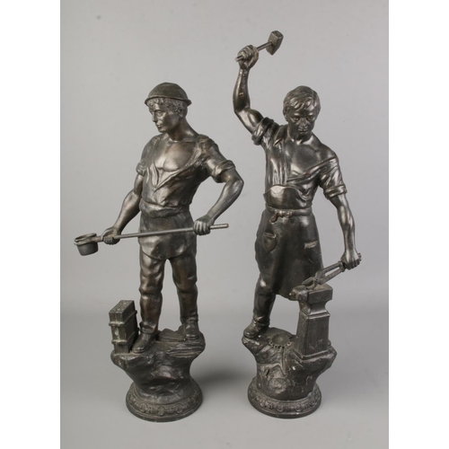 167 - A large pair of spelter figures of a blacksmith and a foundry worker. Tallest 3cm.