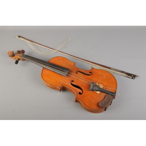 176 - An antique two piece back violin with 