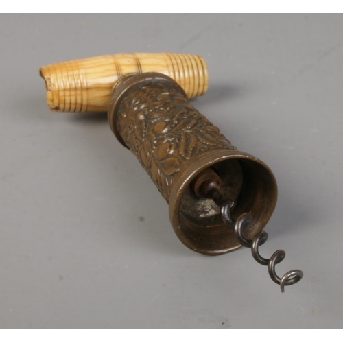 2 - A Thomason type corkscrew, having bone handle and vine decoration to barrel.