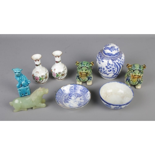 20 - A collection of oriental ceramics and figures to include Jadeite horse, ginger jar, pair of Foo dogs... 