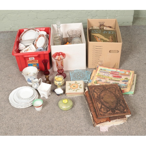 203 - Three boxes of miscellaneous ceramics and glassware to include coloured art glass, Holy Bible, Royal... 