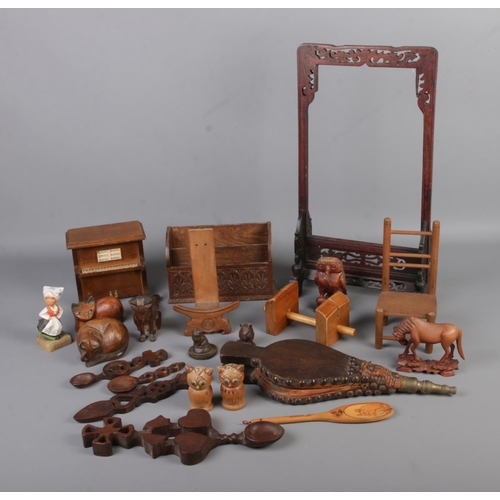 207 - One box of assorted wooden wares to include oriental frame, carved figures, piano photo frame, lette... 