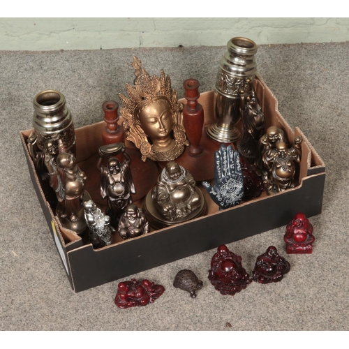 214 - A box of miscellaneous. Includes large quantity of composite Buddha figures, pair of wooden candlest... 