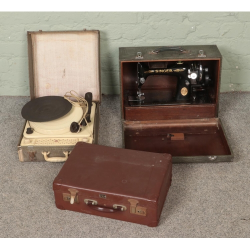 218 - A Regentone portable record player along with vintage hand crank Singer sewing machine and a vintage... 