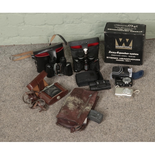 219 - A collection of mostly cameras and binoculars to include Lumix, Charles-Nipole, Wharfedale DD1 boxed... 