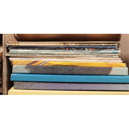 228 - Four boxes of records. Includes Rick Wakeman, Grace Jones, Japan, classical box set etc.