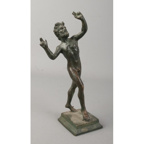 3 - A bronze sculpture of the Roman god Bacchus, raised on stepped base. Height 19cm.