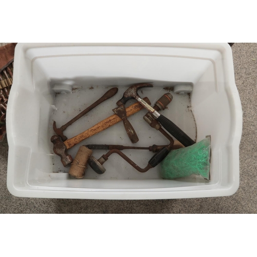 241 - A box of assorted tools. Includes two wooden metre rulers, wooden mallet, hand saw, drill bits etc.