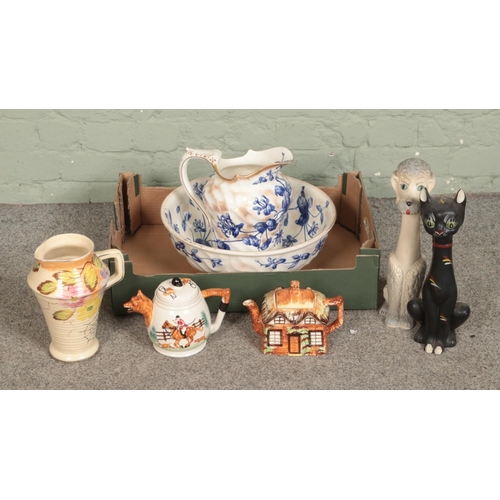 264 - A collection of ceramics including large bowl and jug, ceramic dog and cat figures, Arthur Woods vas... 