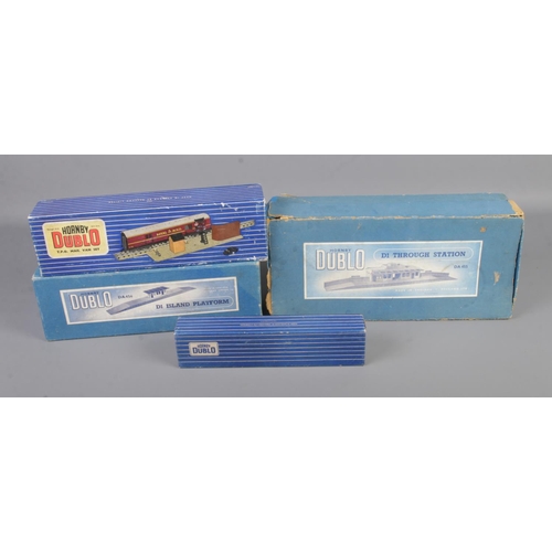 33 - Four boxed Hornby Dublo 00 gauge railway sets to include T.P.O Mail Van set, D1 Through Station, D1 ... 