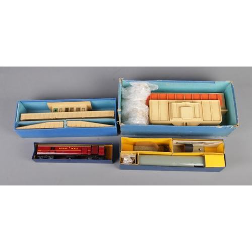 33 - Four boxed Hornby Dublo 00 gauge railway sets to include T.P.O Mail Van set, D1 Through Station, D1 ... 