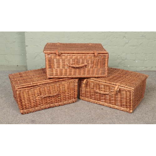 277 - Three large wicker baskets/hampers.

All approx 52cm long.