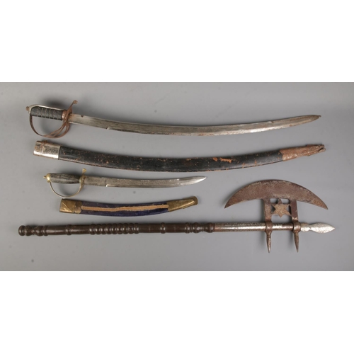 285 - Two vintage Indian dress swords with scabbards along with a modern decorative Indian axe with star d... 