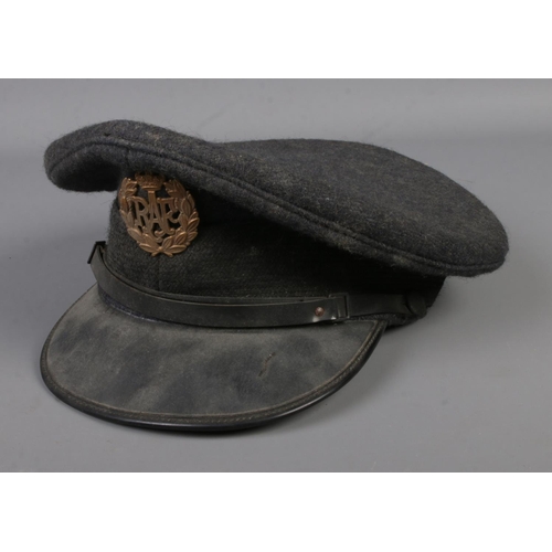 59 - A vintage Royal Air Force hat with corresponding cap badge. Label to inside for SAC 3151534 Lawrence... 