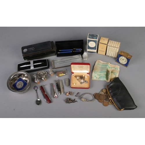 67 - A good collection of assorted collectables to include pen knives, British coins, United Arab Emirate... 